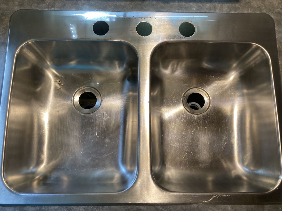 Double basin stainless steel sink with three faucet holes