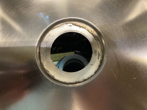 2015 Ford F-550 - The drain opening of a stainless steel sink shows wear and residue around the rim.