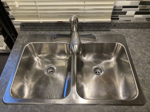 2015 Ford F-550 - Double stainless steel sink with a single-handle faucet installed on a countertop.