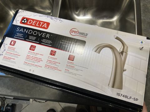 2015 Ford F-550 - The box displays a Delta Sandoover faucet with SpotShield technology and a worry-free drain catch.