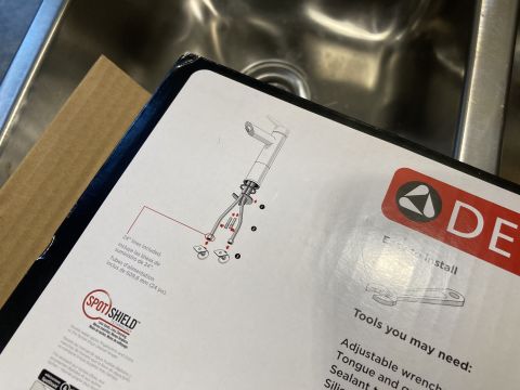2015 Ford F-550 - Photographed Delta faucet installation instruction sheet showing an exploded parts diagram of the faucet assembly.