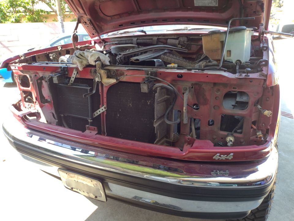 1994 Ford Bronco front end with hood open, showing radiator and engine components