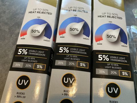2015 Ford F-550 - Packaging for window tint film, detailing its heat rejection and light transmission properties.