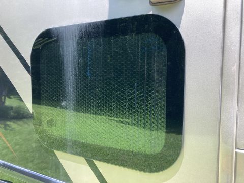 2015 Ford F-550 - Close-up of a vehicle's side window reflective insulation material.
