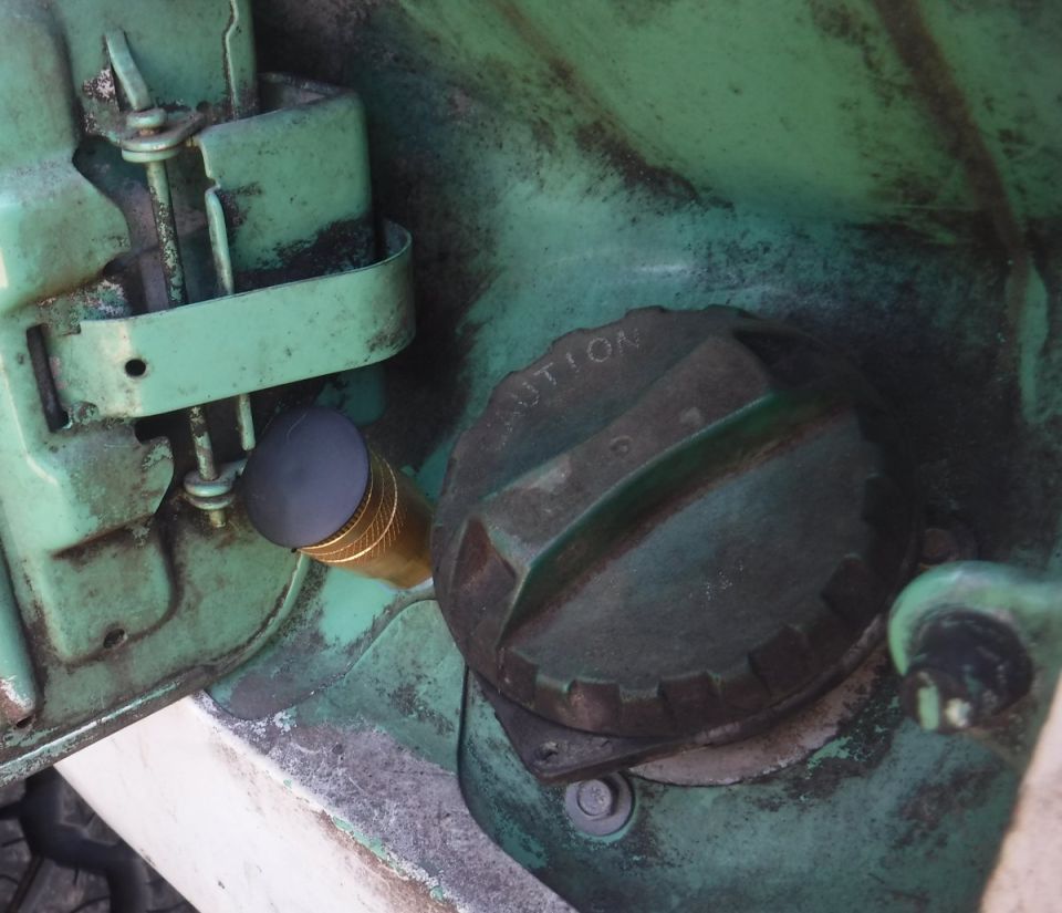 Rear air coupler installed.  I ground a big washer at an angle to go on the backside of the body panel, so as to push the coupler away from the hinge, as the existing hole is ever so slightly too close for easy operation.