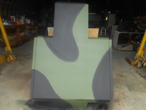 1992 Ford Bronco - A large, T-shaped target painted in camouflage colors sits in a workshop.