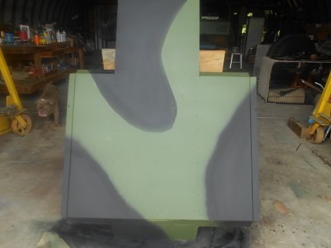 1992 Ford Bronco - A camouflaged panel is shown in a garage setting with a dog and various tools visible in the background.