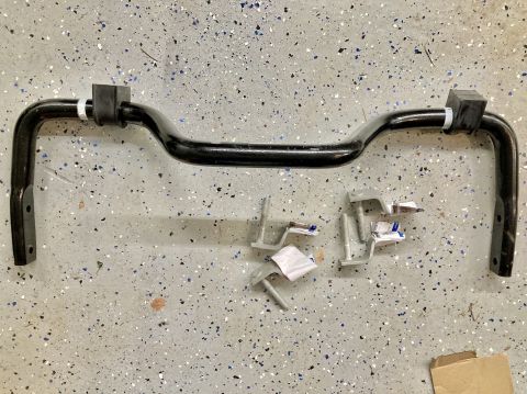2015 Ford F-550 - Sway bar and hardware for a Ford F-550, laid out on a garage floor.