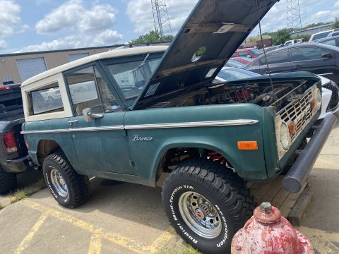1976 Ford Bronco - This 1976 Ford Bronco is shown with its hood up, revealing the engine bay.