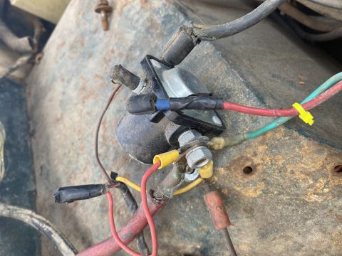 1976 Ford Bronco - Close-up view of the engine bay wiring harness, an ignition coil and various colored wires connected to terminals.