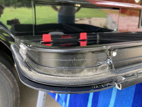 2015 Ford F-550 - This is a close-up view of an RV window frame, showing the rubber seal and some dust accumulation.