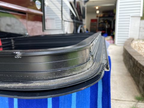 2015 Ford F-550 - Close-up of a damaged window seal, suggesting a need for replacement.