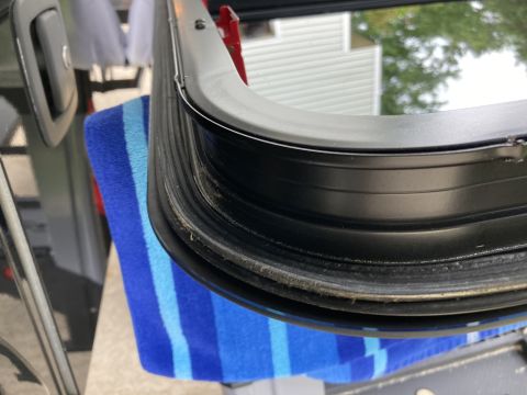 2015 Ford F-550 - Detail of a vehicle's window seal, showing the rubber gasket and frame.