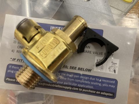 2015 Ford F-550 - A Fumoto F106 oil drain valve is shown with its packaging and instructions.