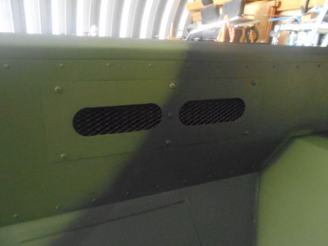 1992 Ford Bronco - Interior panel with mesh vents and rivets, likely from a vehicle.
