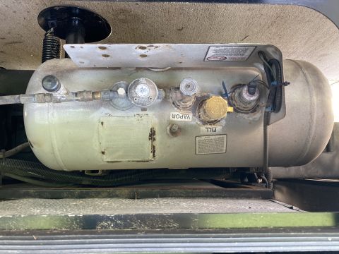 2015 Ford F-550 - A propane tank assembly is shown with its associated valves and fittings.