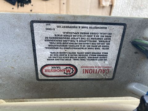 2015 Ford F-550 - A label on a propane tank from Manchester Tank & Equipment Co. indicates it is manufactured to specific standards and includes safety warni…