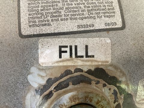 2015 Ford F-550 - A propane tank shows a 'FILL' label and a warning about valve operation and service.