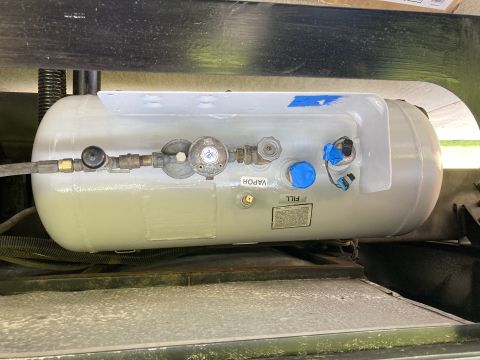 2015 Ford F-550 - Close-up of a propane tank assembly, showing various fittings and labels.