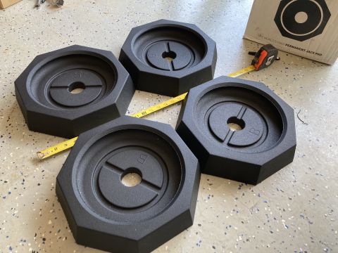 2015 Ford F-550 - Four leveling jacks are shown with a measuring tape and a box for a jack pad.