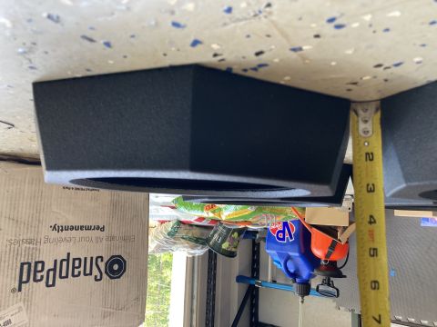 2015 Ford F-550 - A black RV leveling jack component is shown with a tape measure, next to a box for SnapPad leveling systems.