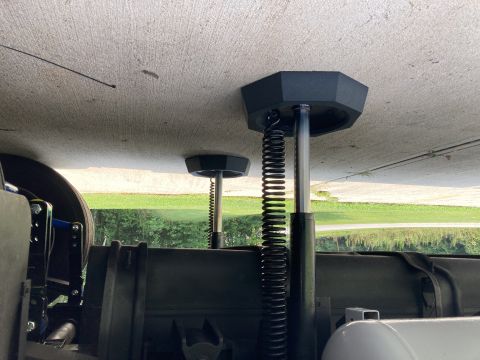 2015 Ford F-550 - Underside view of leveling jacks with coiled springs extended.