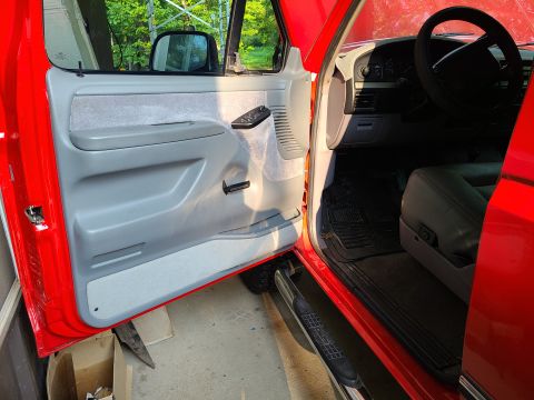 1995 Ford Bronco - CoverLay door panels are the only new replacements available. The dash carpet is installed with adhesive velcro pads. An aftermarket steeri…
