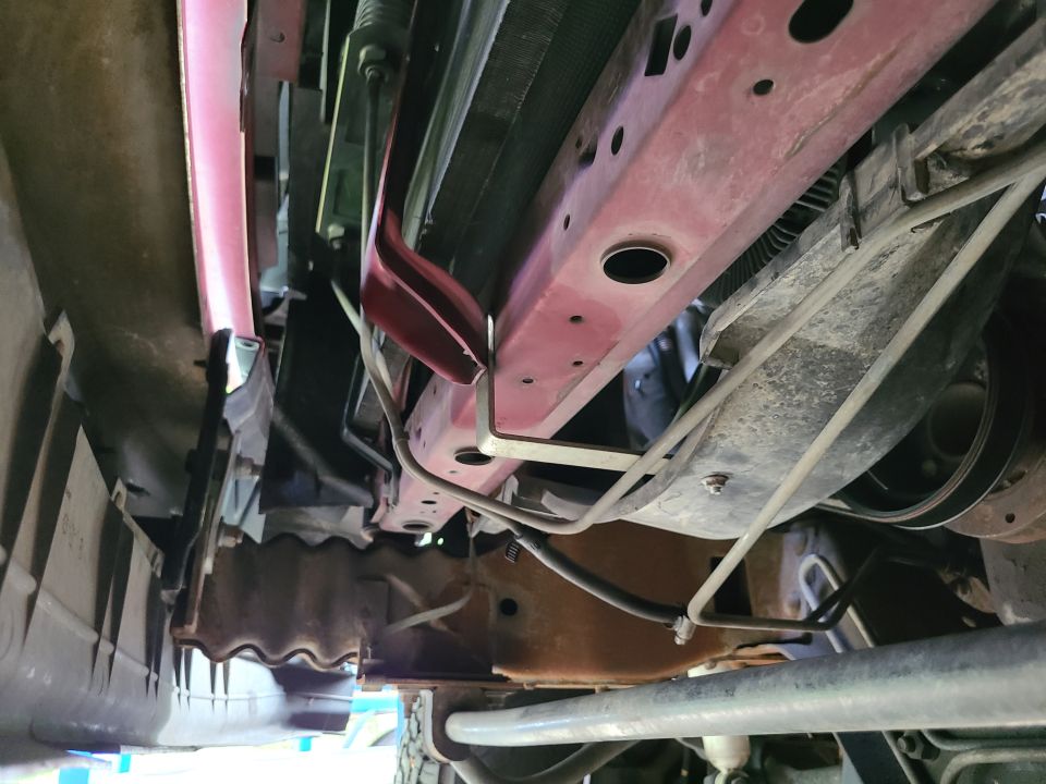 The body lift necessitated lowering the fan shroud, bending the ATF cooler lines, and raising the bumper (poorly).
IF THE IMAGE IS TOO SMALL, click it.