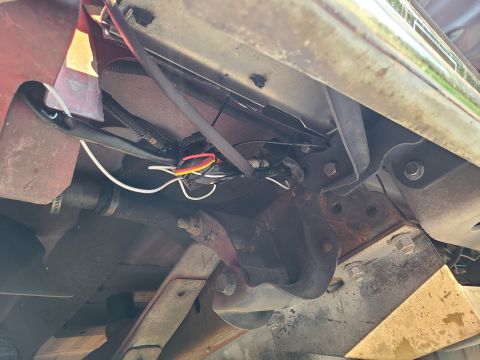 1995 Ford Bronco - The line of fire adapter is hung on the wiring where it may be damaged by mud, gravel, or debris thrown by the tire. The hitch receiver app…