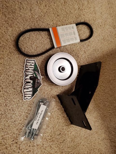 1996 Ford Bronco - Parts for an on board air kit including a V-belt, pulley, bracket, and hardware.