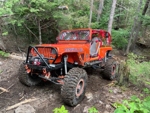 1992 Jeep Wrangler - This modified Jeep is equipped with large tires and a roll cage for off-road adventures.