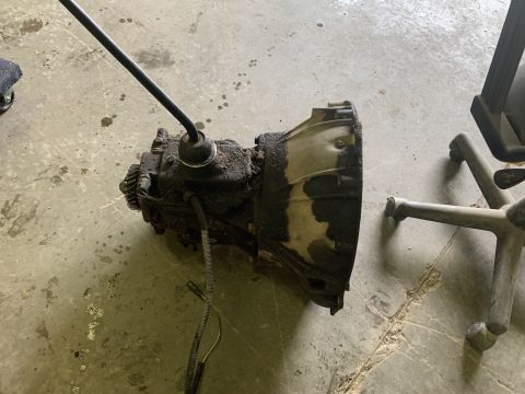 1979 Jeep CJ5 - This is a transmission with a shifter lever, likely removed from a vehicle.
