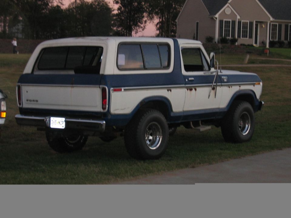 White and blue 1978 Ford Bronco rear quarter view. License plate reads 'FHS-678'