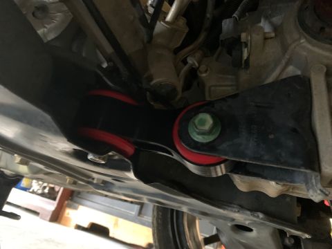 2008 Ford Focus - Close-up view of aftermarket suspension parts on a vehicle's undercarriage.