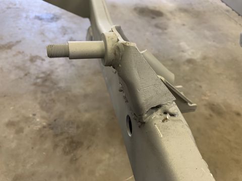 1979 Jeep CJ5 - A close-up view of a vehicle's frame shows a bolt protruding from a bracket.