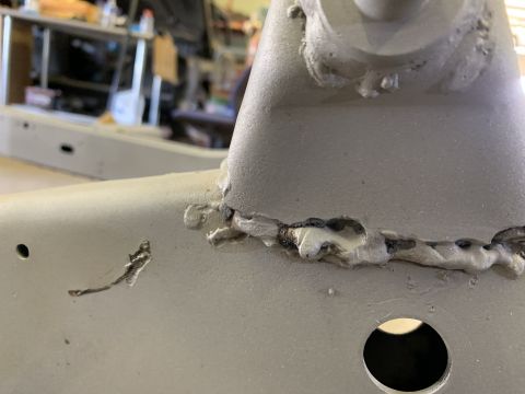1979 Jeep CJ5 - Close-up of a vehicle frame showing welds and a cutout, with a watermark at the bottom right.