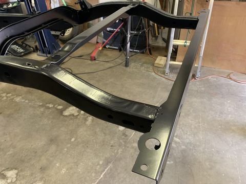 1979 Jeep CJ5 - The chassis of a vehicle is shown after being painted black.