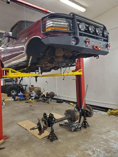 1996 Ford Bronco - This 1996 Ford Bronco is undergoing work, with the front axle detached and ready for modification or repair.