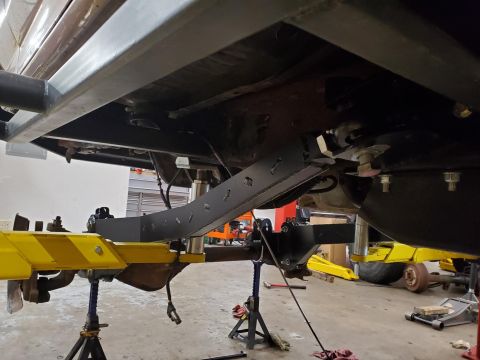 1996 Ford Bronco - Custom suspension and frame work being performed on a vehicle's underbody.