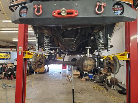 1996 Ford Bronco - Underbody view of a 1996 Ford Bronco showing suspension modifications and front axle.