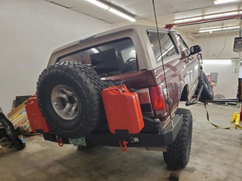 1996 Ford Bronco - This 1996 Ford Bronco features a custom rear bumper, spare tire mount, and two jerry cans.