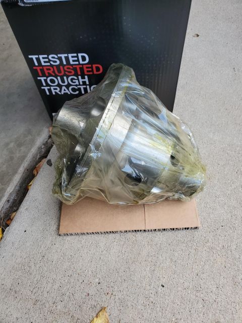 1996 Ford Bronco - Differential part in plastic wrap, with a box that says "TESTED TRUSTED TOUGH TRACTION".