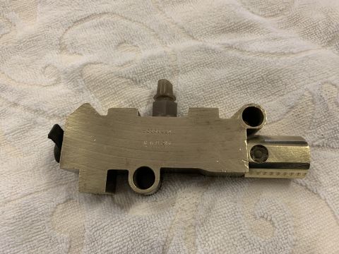1979 Jeep CJ5 - A close-up view of a brake master cylinder, a critical component for a vehicle's braking system.