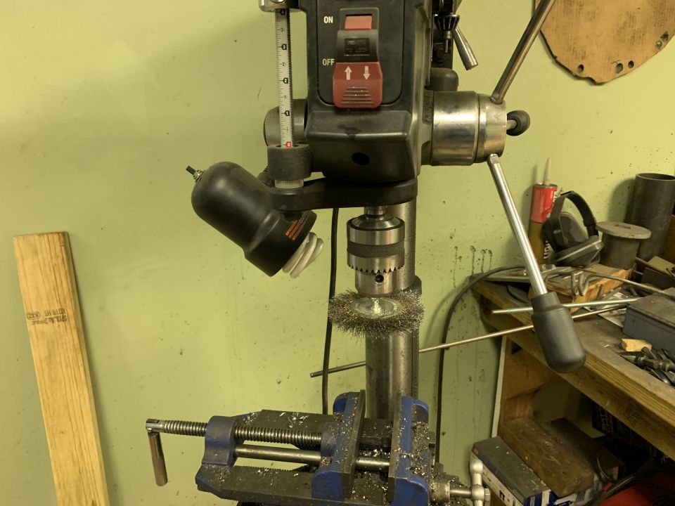 Drill press with wire wheel attachment and blue vise