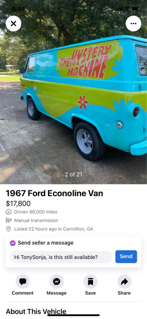 2008 Ford Focus - 1967 Ford Econoline van, painted as the Mystery Machine from Scooby-Doo, is shown from the side.
