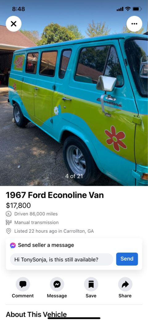 2008 Ford Focus - This van is painted in a distinctive turquoise and lime green color scheme with flower decals.