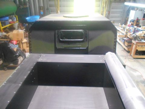 1992 Ford Bronco - A workshop scene displays a custom truck bed modification with a dark, boxy interior structure.