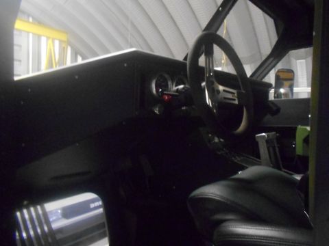 1992 Ford Bronco - The interior of a vehicle is visible, with a focus on the dashboard and steering wheel area.