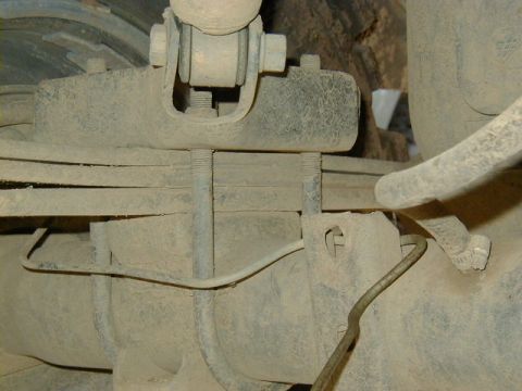 1994 Ford Explorer - Rear axle leaf spring U-bolts and hardware, dusty condition.
