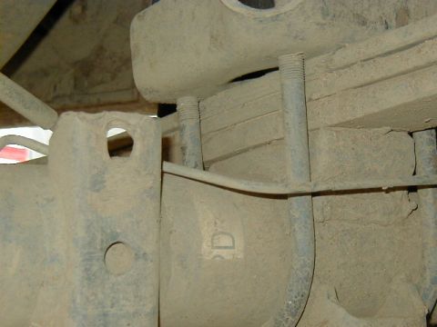 1994 Ford Explorer - Detail of a vehicle's rear axle assembly, focusing on the leaf spring attachment point.